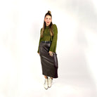 olive crochet style open knit sweater worn by woman gyal bashy