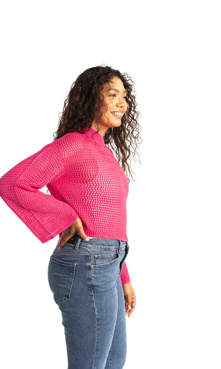 pink crochet style open knit sweater worn by woman gyal bashy