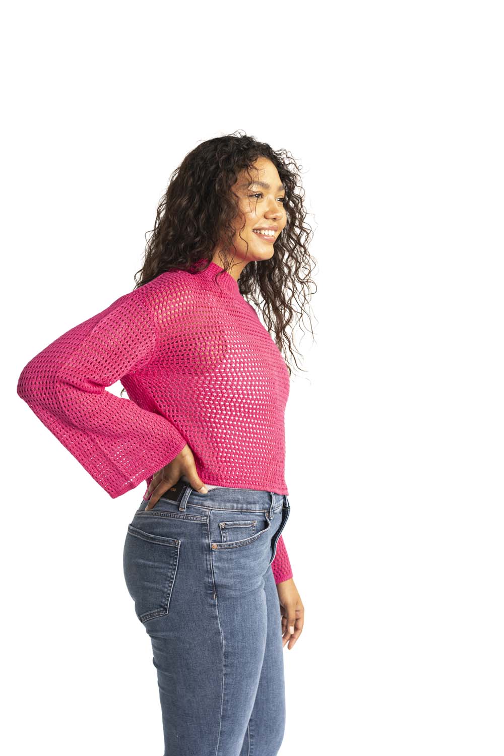 pink crochet style open knit sweater worn by woman gyal bashy