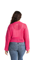 pink crochet style open knit sweater worn by woman gyal bashy