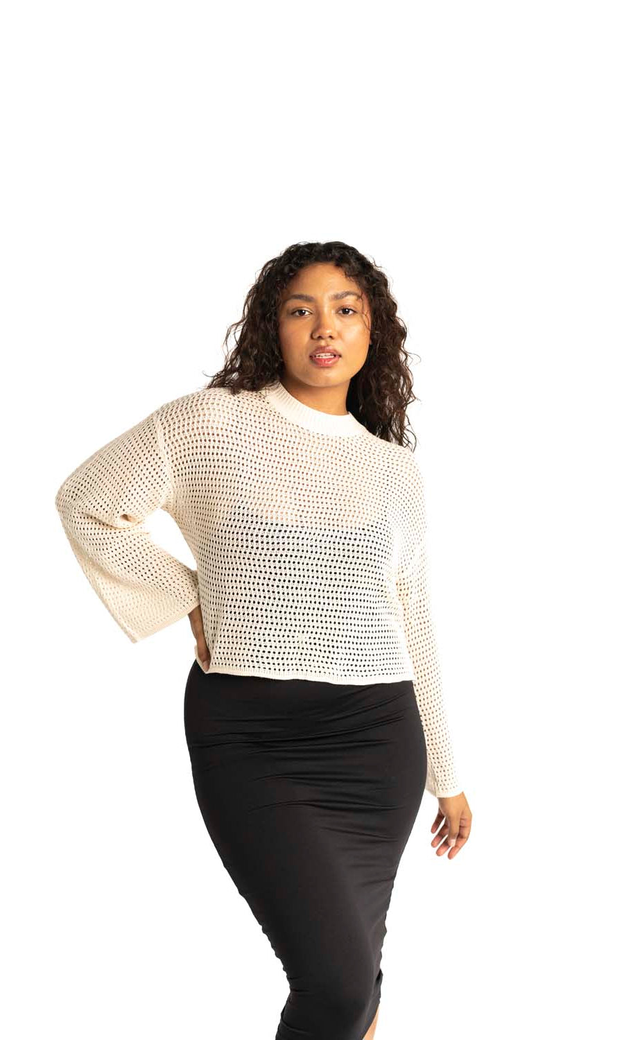 white crochet style open knit sweater worn by woman gyal bashy