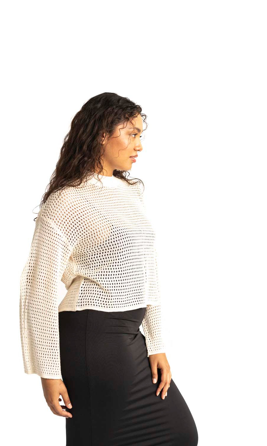 white crochet style open knit sweater worn by woman gyal bashy