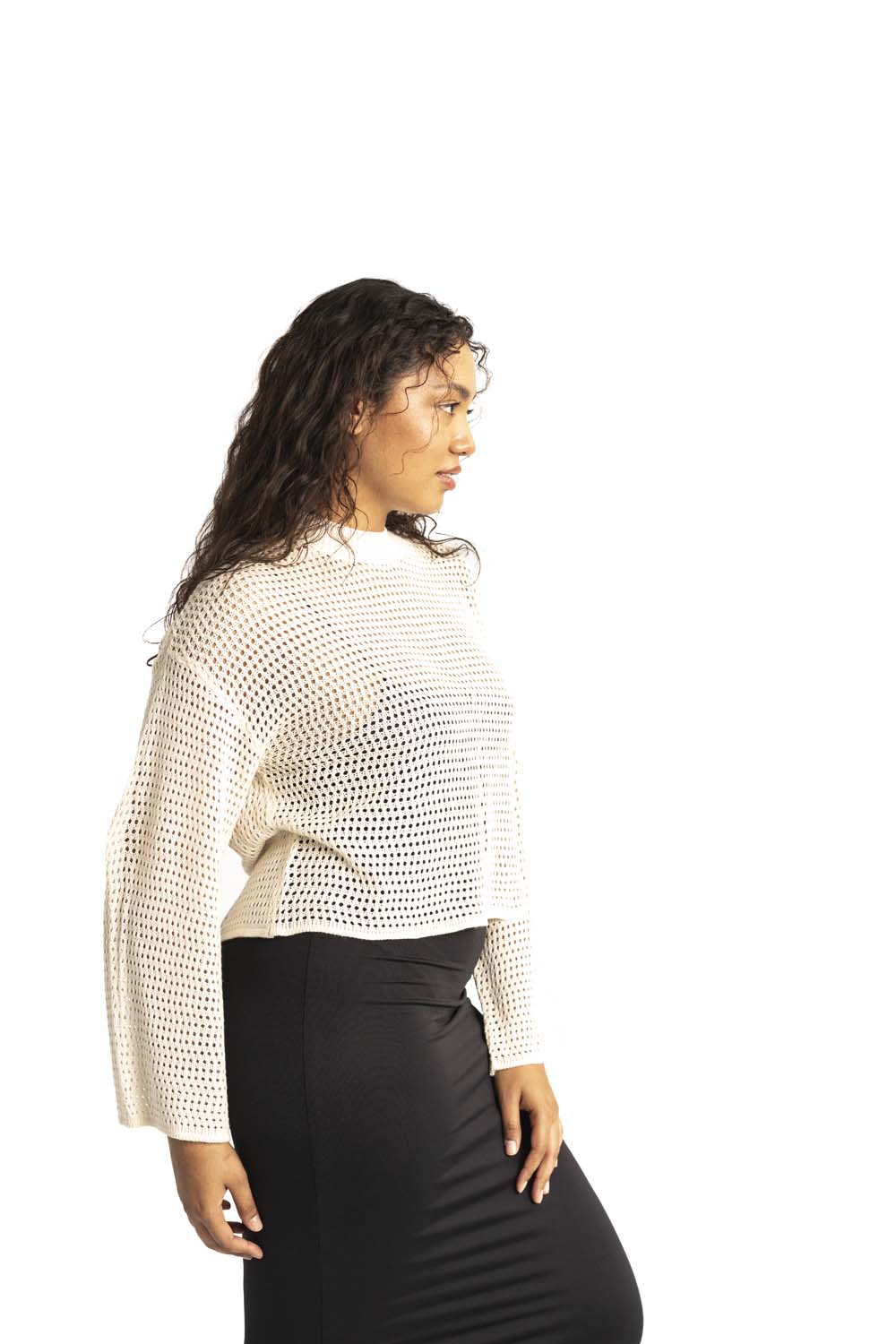 white crochet style open knit sweater worn by woman gyal bashy