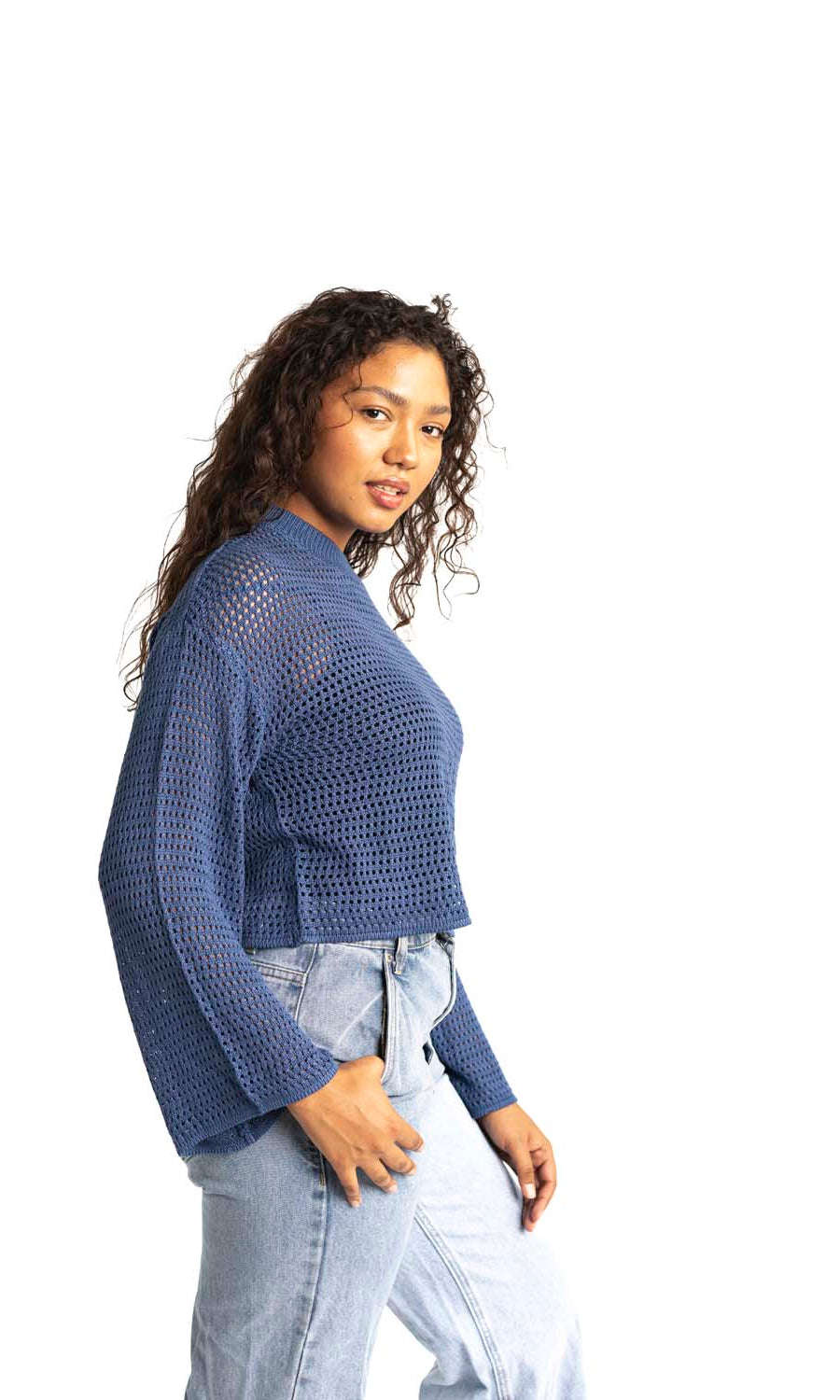 blue crochet style open knit sweater worn by woman gyal bashy