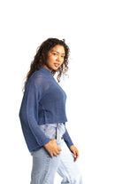 blue crochet style open knit sweater worn by woman gyal bashy